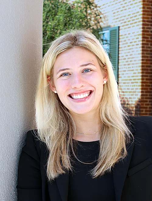 person outdoors smiling at camera