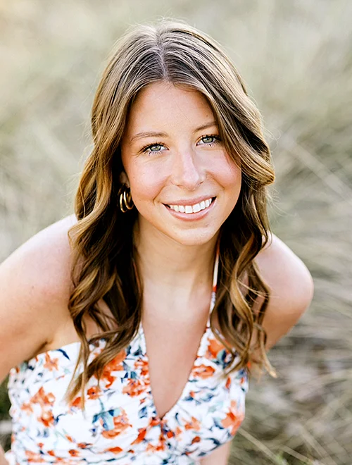 person outdoors smiling at camera