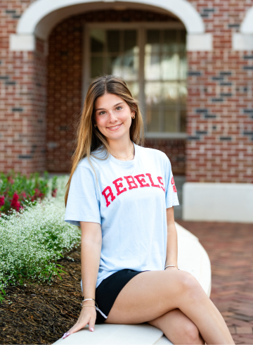 Sohpia sitting outside on the Ole Miss Campus in Oxford