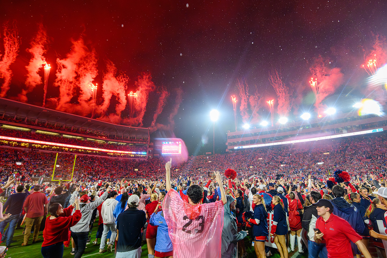 Ole Miss students stand up and cheer during a football game in Vaught Hemingway Stadium.