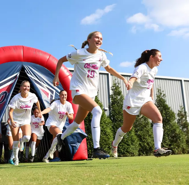 Ole miss soccer team emerging from the tunnel before a game against arkansas