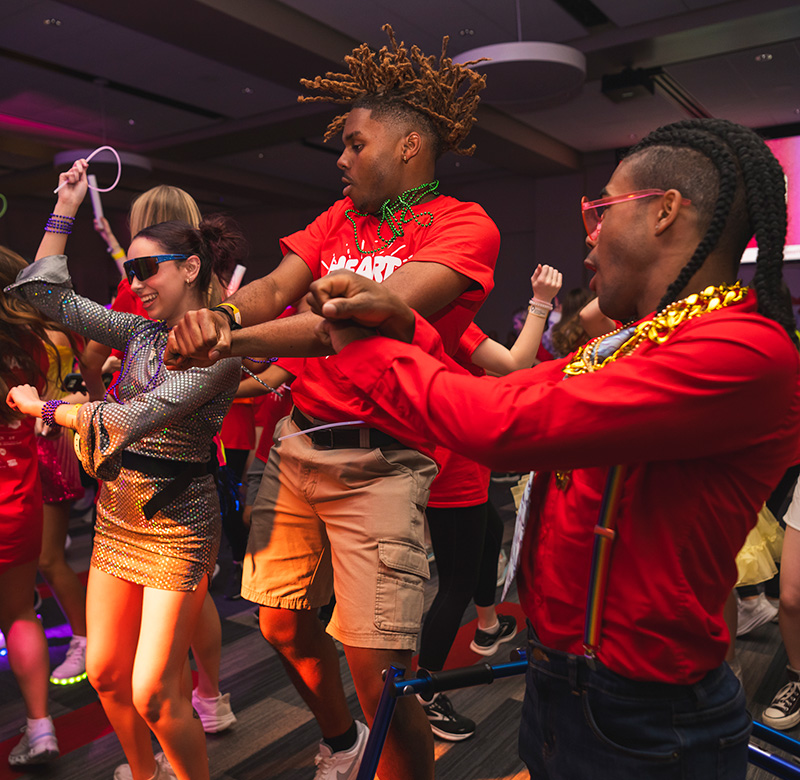 Students dance at night at the rebelthon fundraiser