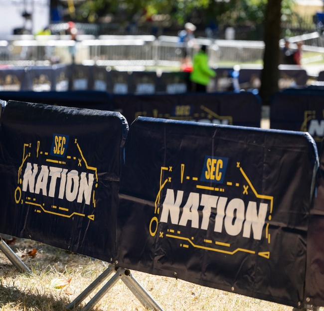 SEC Nation banners hanging on railing in The Grove
