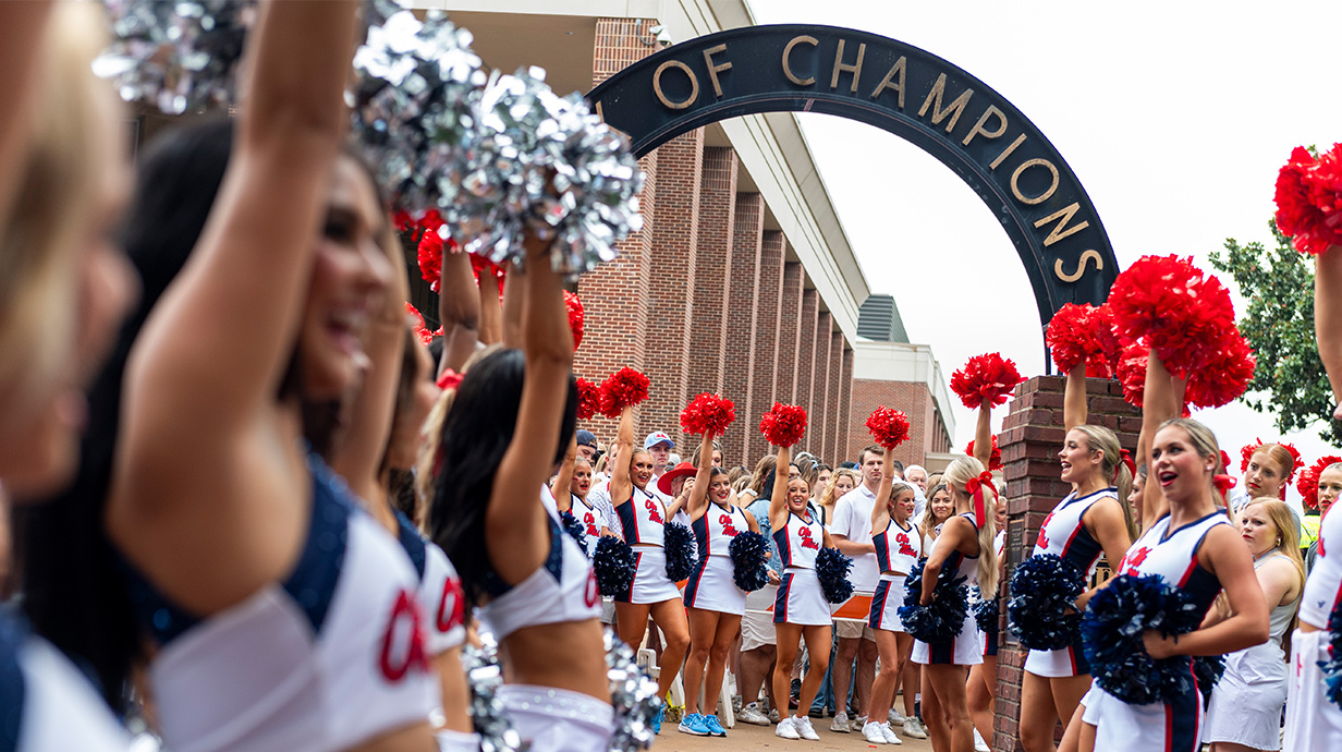 Walk of Champions pathway flooded with Ole Miss fans on game day.