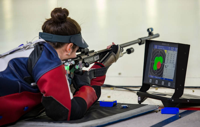 An Ole Miss rifle player lines up a shot