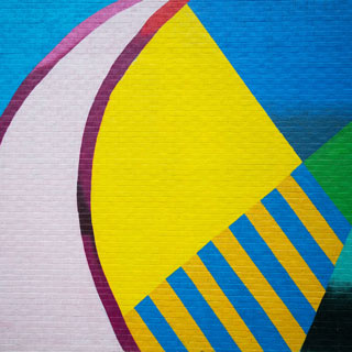 Cropped section of brightly-colored, geometric, local Oxford mural. 