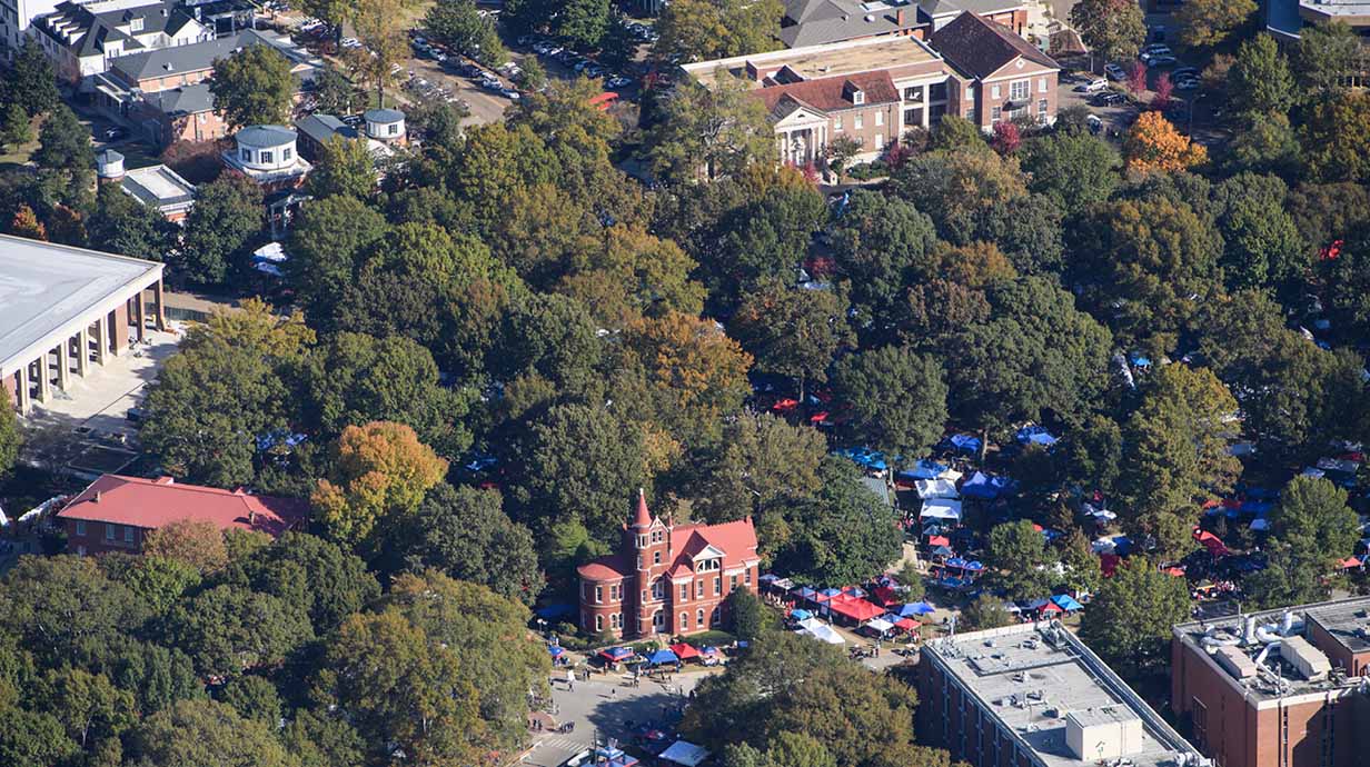 An aerial shot of the Grove packed with tents on a gameday Saturday in the fall.