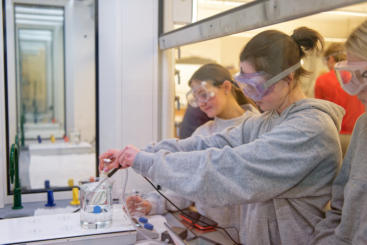 Students working with chemicals in a lab