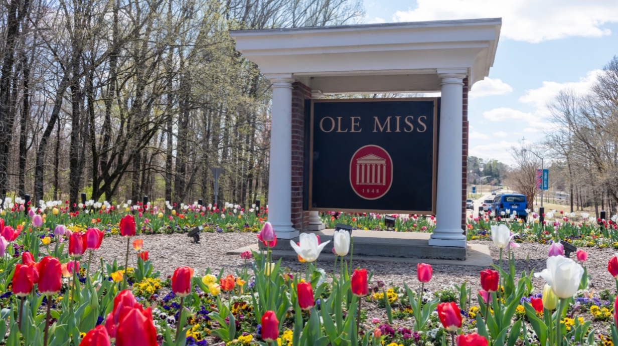 University of Mississippi faculty and staff walking on campus