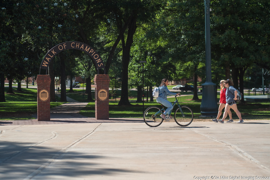 Girl Riding Bike on Walk of Champions