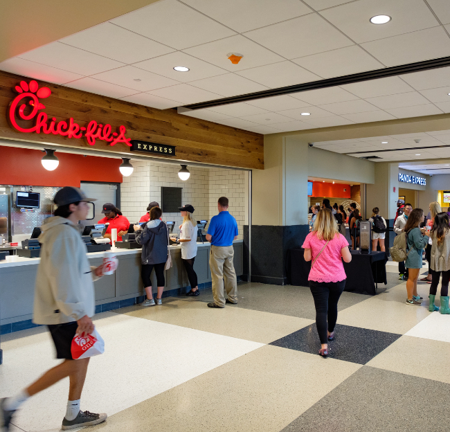 Students and employees walk by the Chick-fil-a in the Student Union