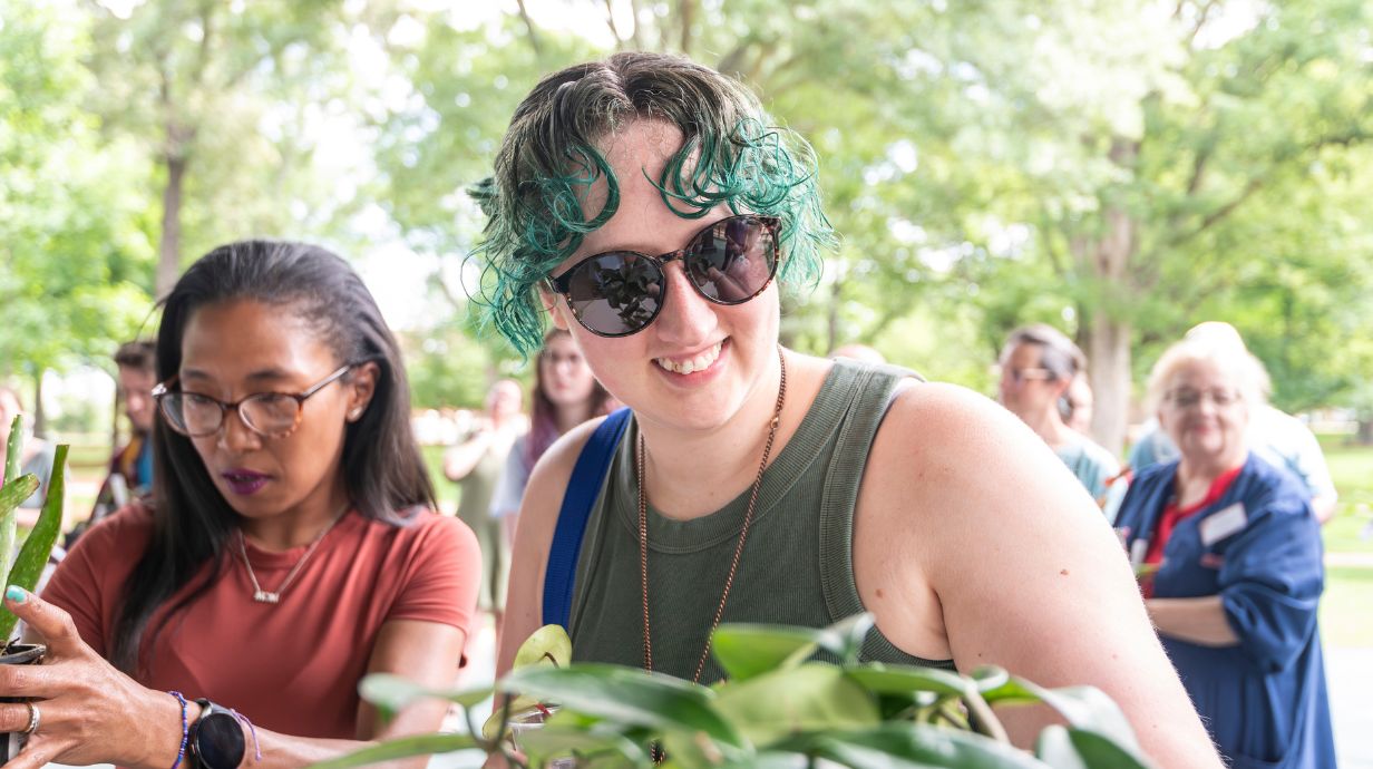 Woman smiling at a plant fair