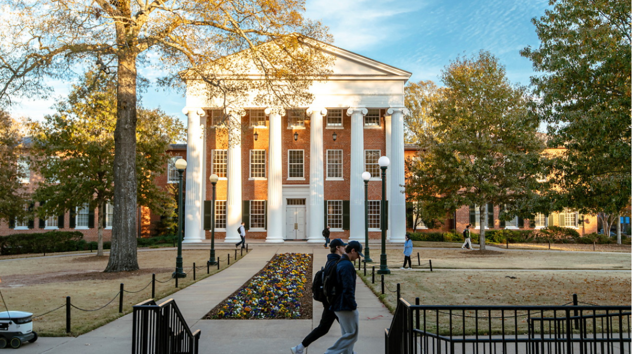 Image of student walking past the Lyceum.