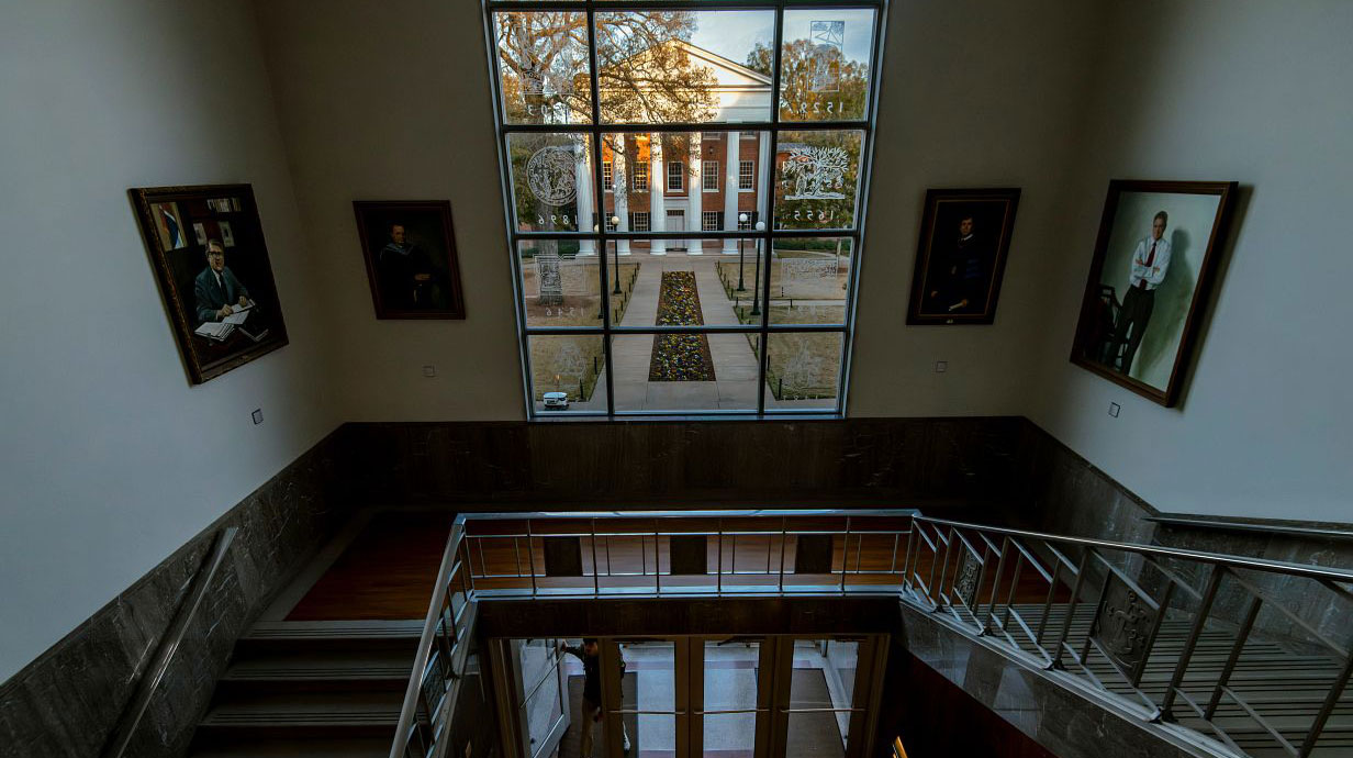 The Lyceum on the University of Mississippi campus looking through the J.D. Williams Library window