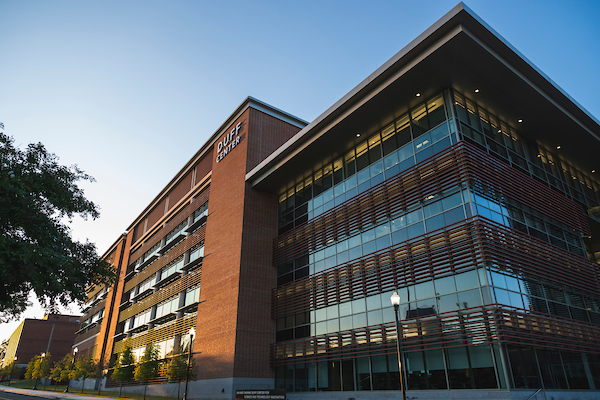 Duff Center building with the sun reflecting it