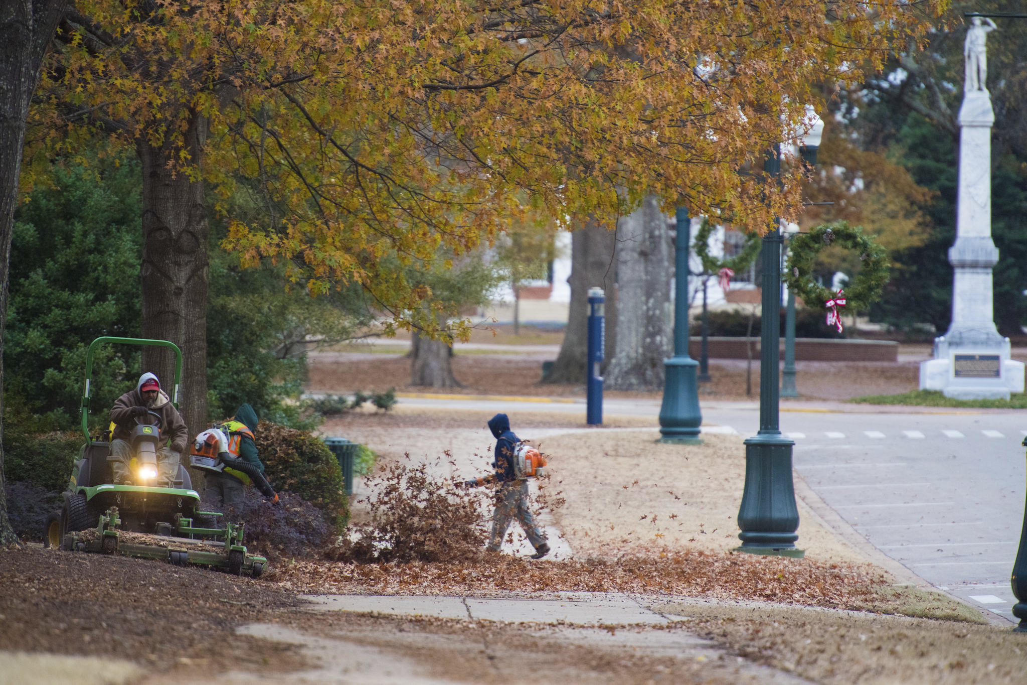 Staff blowing leaves to clean area on Ole Miss campus 