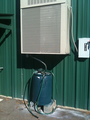 Green water barrel at Ole Miss Landscape Services 