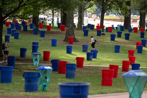 Red and blue trash cans in the Grove