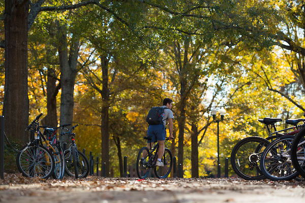 Student biking on campus