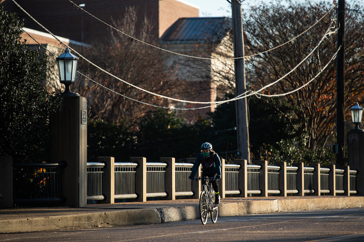 Bicyclist riding on Ole Miss campus.