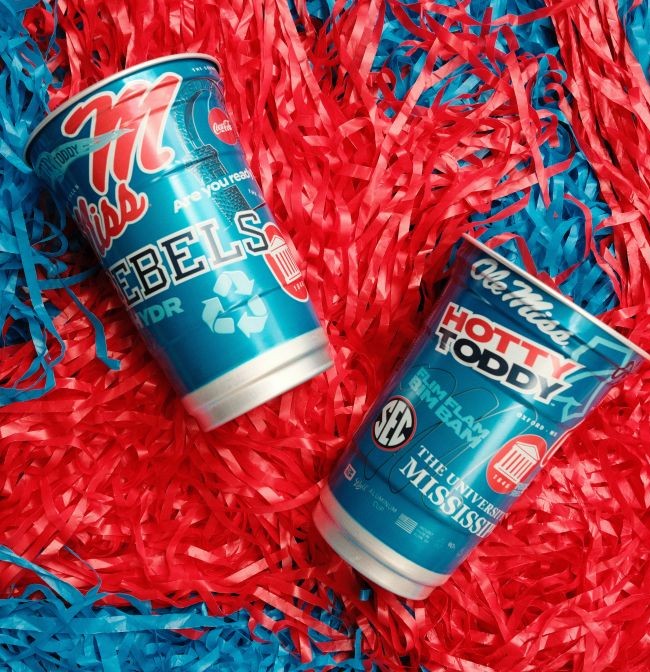 Ole Miss Aluminum Cups on background of red and blue pompoms.
