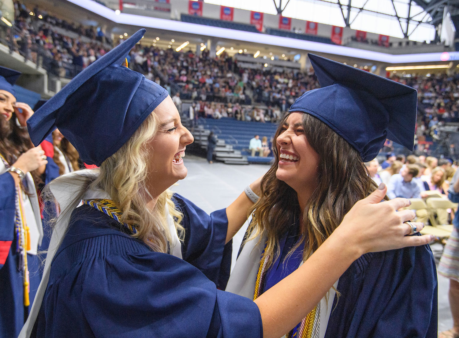 Students Laughing at Graduation