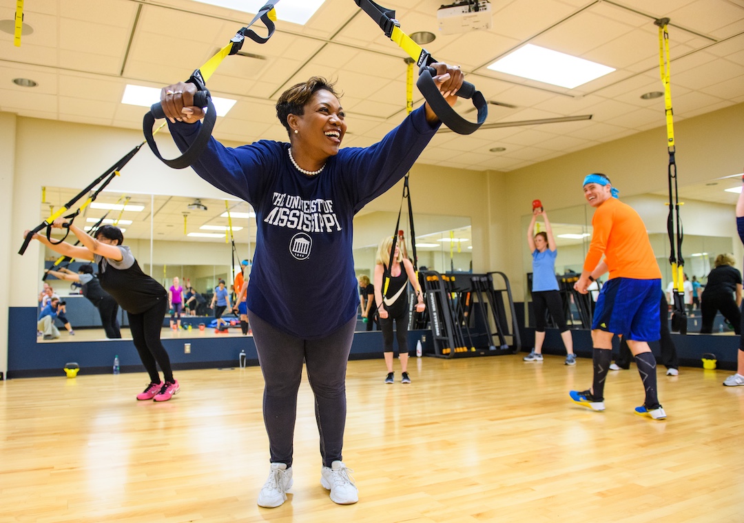 UM employees participate in a group fitness class.  