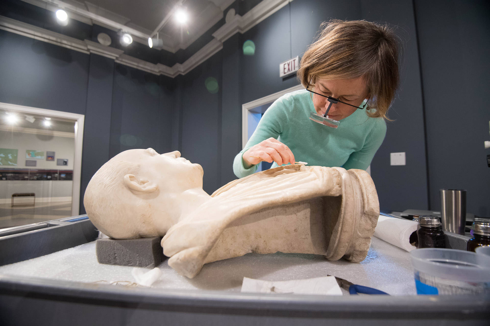 Museum Employee Cleaning a statue