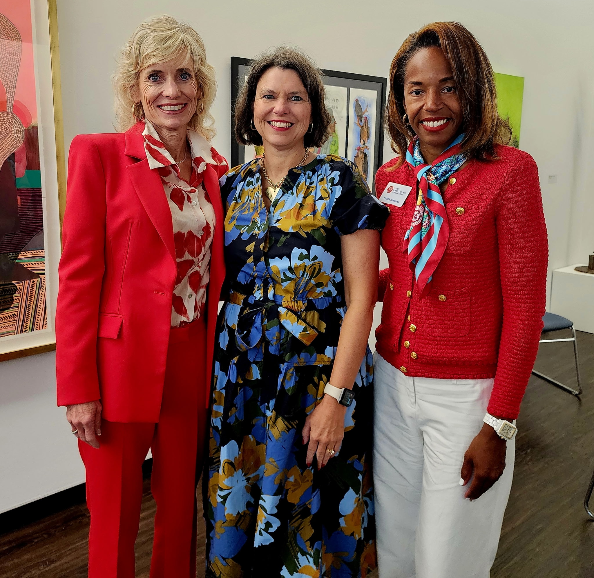 three women standing for a picture
