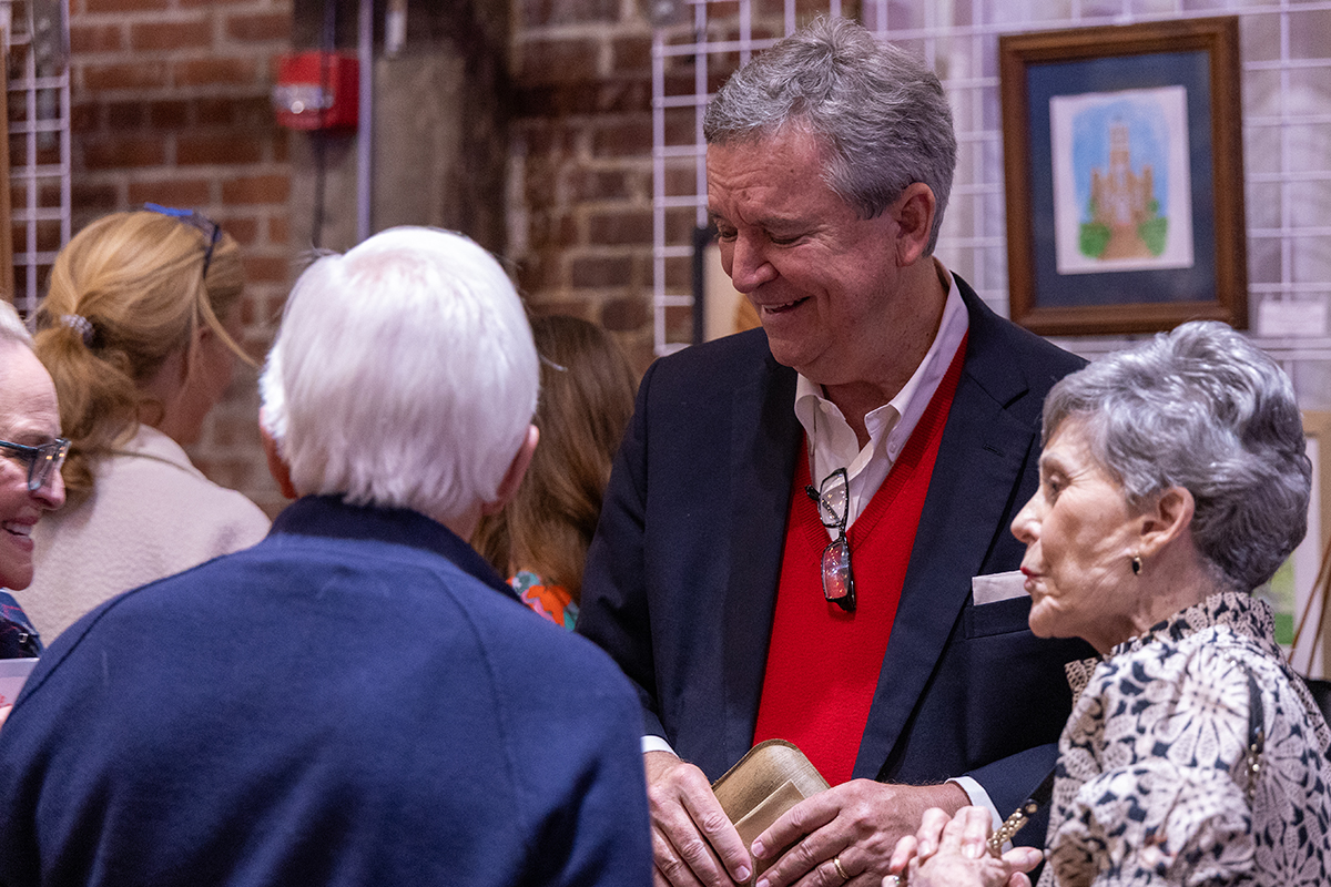 group of adults talking to one another