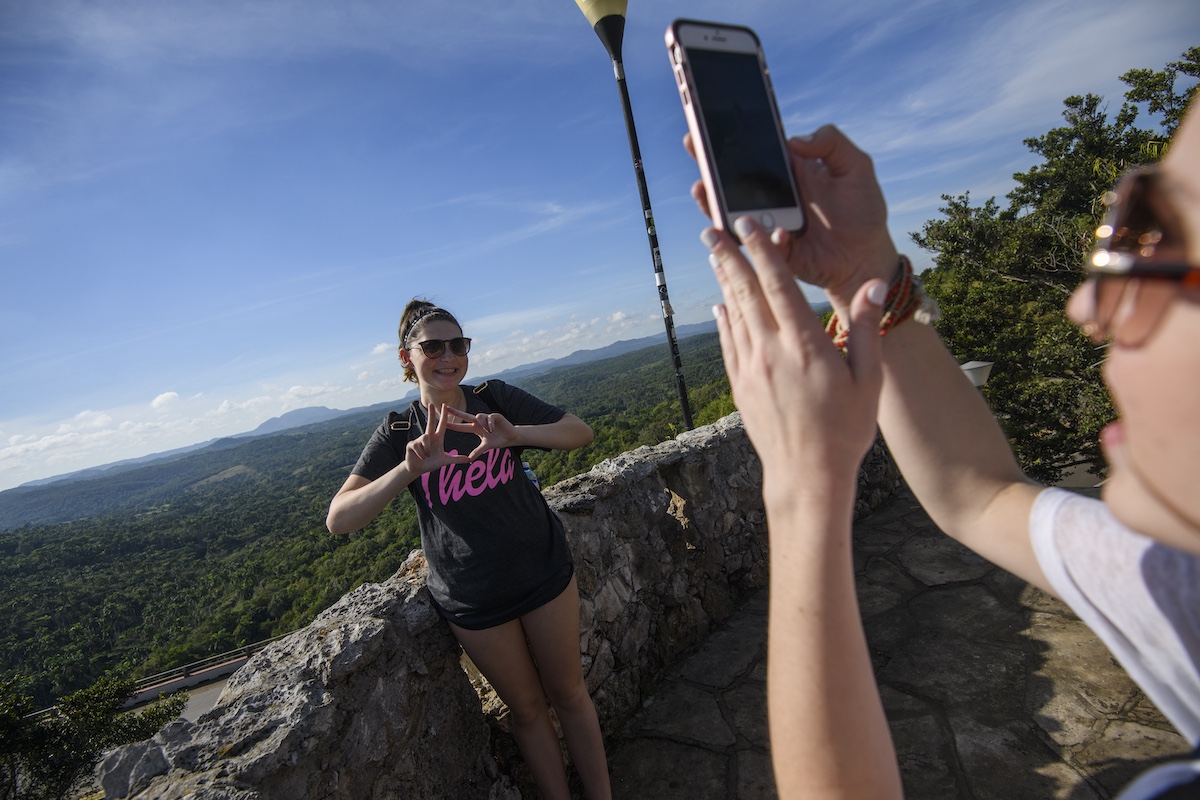 A students takes a photo of another student