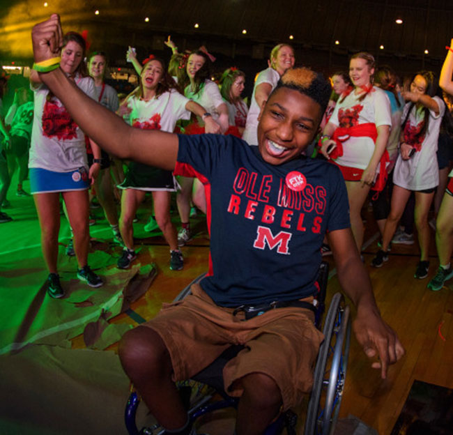 Students and others dance during RebelTHON