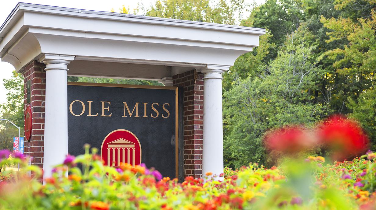 Ole Miss sign greets those who enter campus in spring time