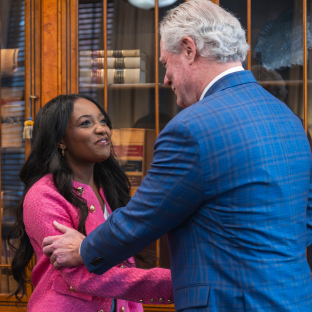 An image of Yasmine Ware shaking hands with Chancellor Boyce