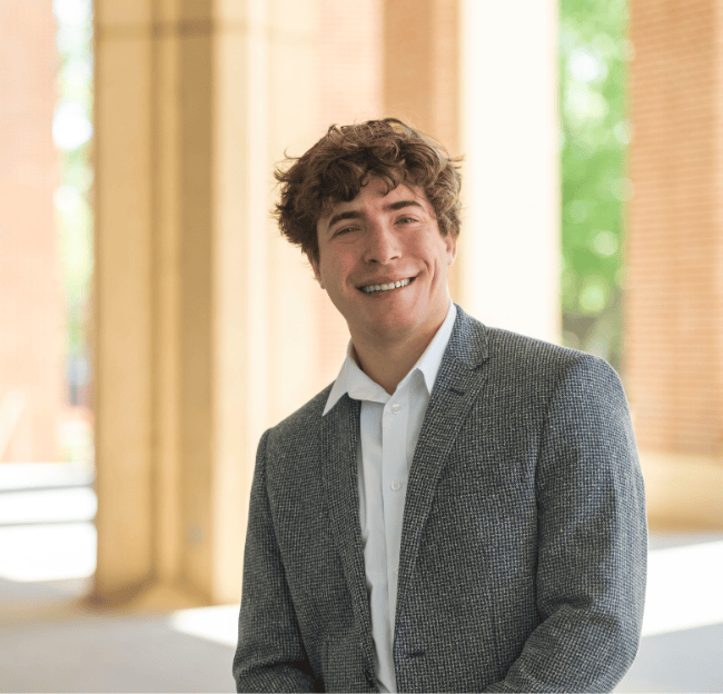 An image of Maxwell Glasser outside.