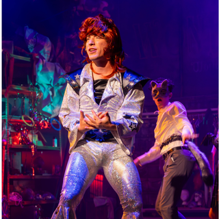 An image of Maxwell Glasser performing in 'Ride the Cyclone'.