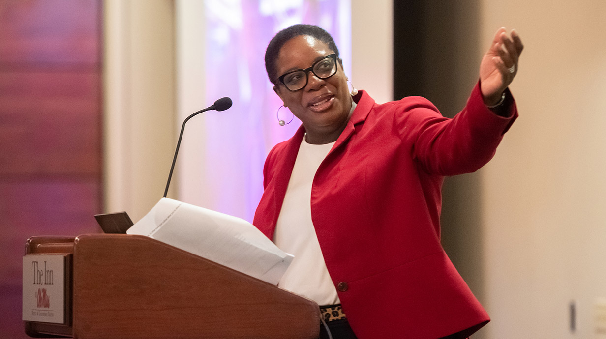 Natashia Gregoire of FedEx speaks at a podium during the 2019 UMC3 Summit
