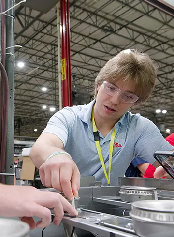 An Ole Miss engineering student works in the Viking Range LLC plant in Greenwood, MS