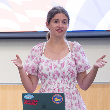 Rising high school freshman Naomi Blair presents her proposed legislation to the mock joint legislative session as part of the Lott Institute’s summer program.