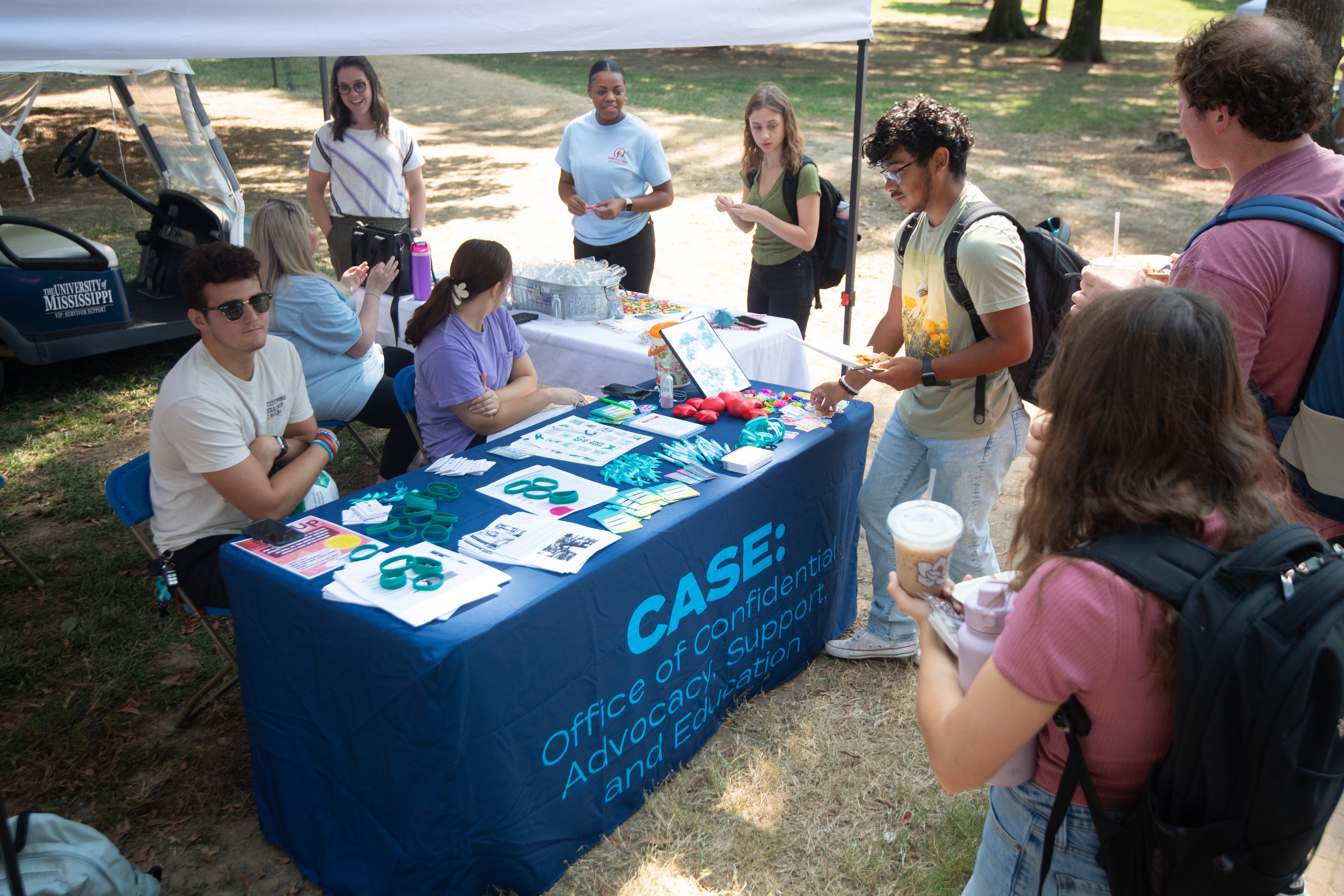 Students getting information at Fresh Check Day in the Grove. 