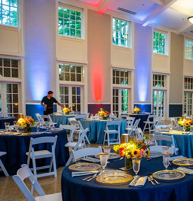 Special Events employee Setting up a dining table