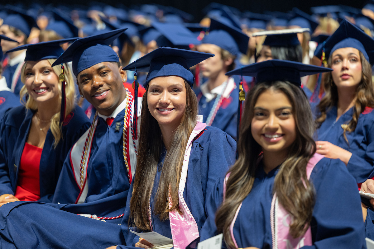 Graduates sitting at a ceremony 