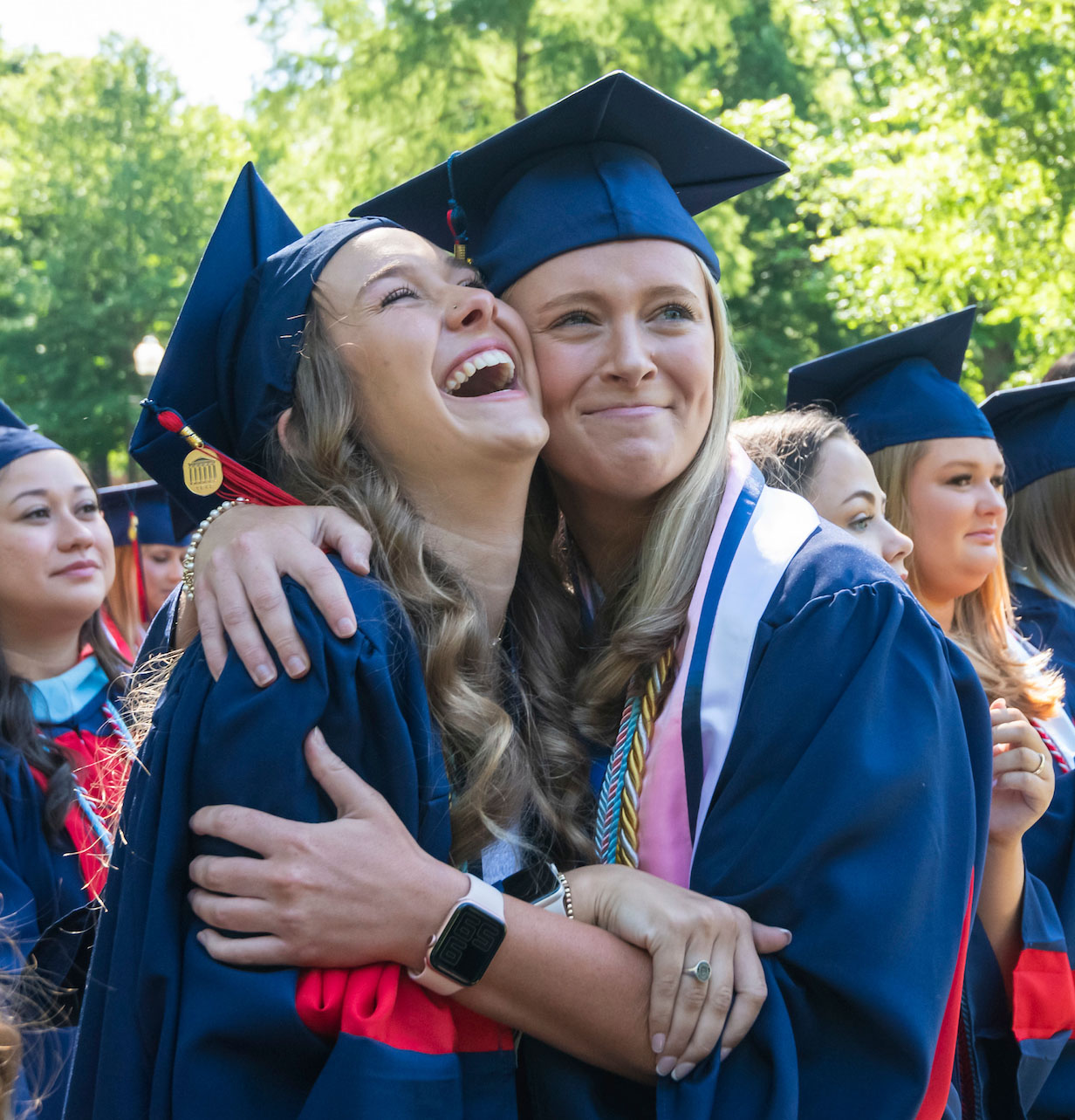 Two girls celebrating graduating from Ole Miss