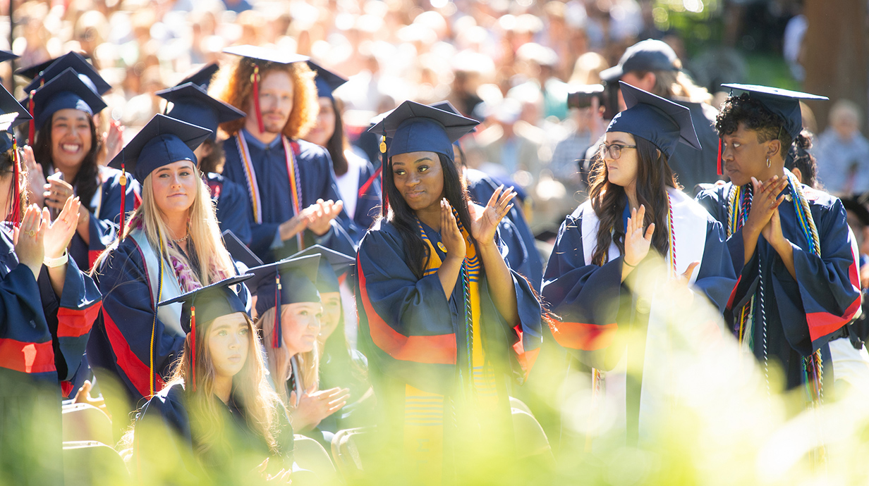 Ole Miss Commencement: Students watch the ceremony unfold. 