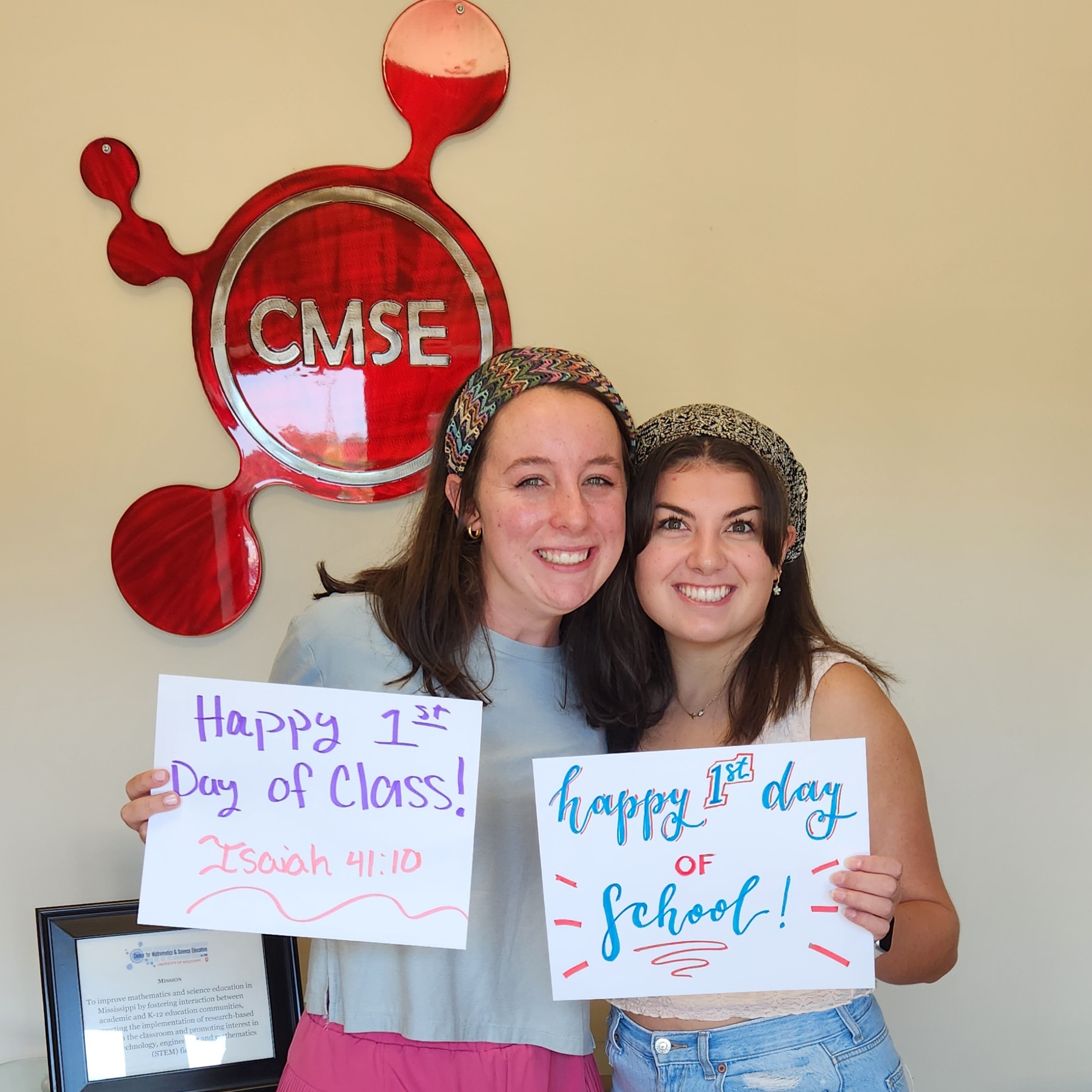 Two students pose for the first day of the academic year.