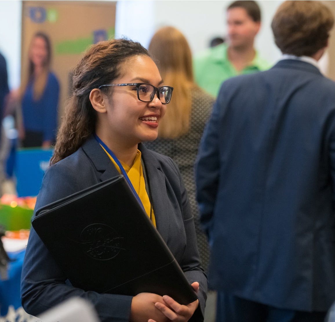 woman speaking at a career fair