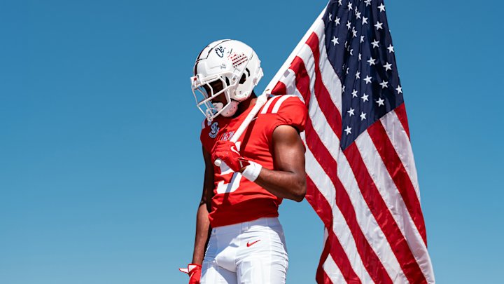 FB Play holding US Flag