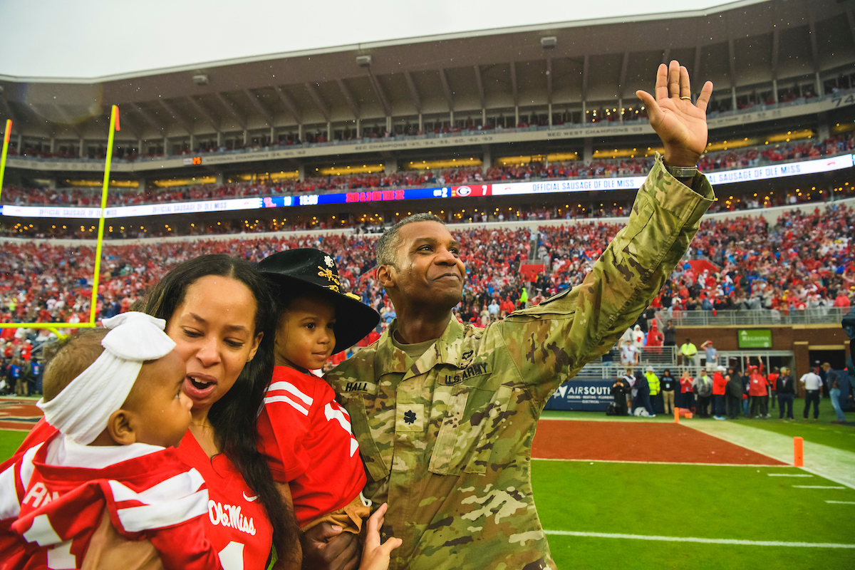 A veteran reuniting with his family during an Ole Miss football game.