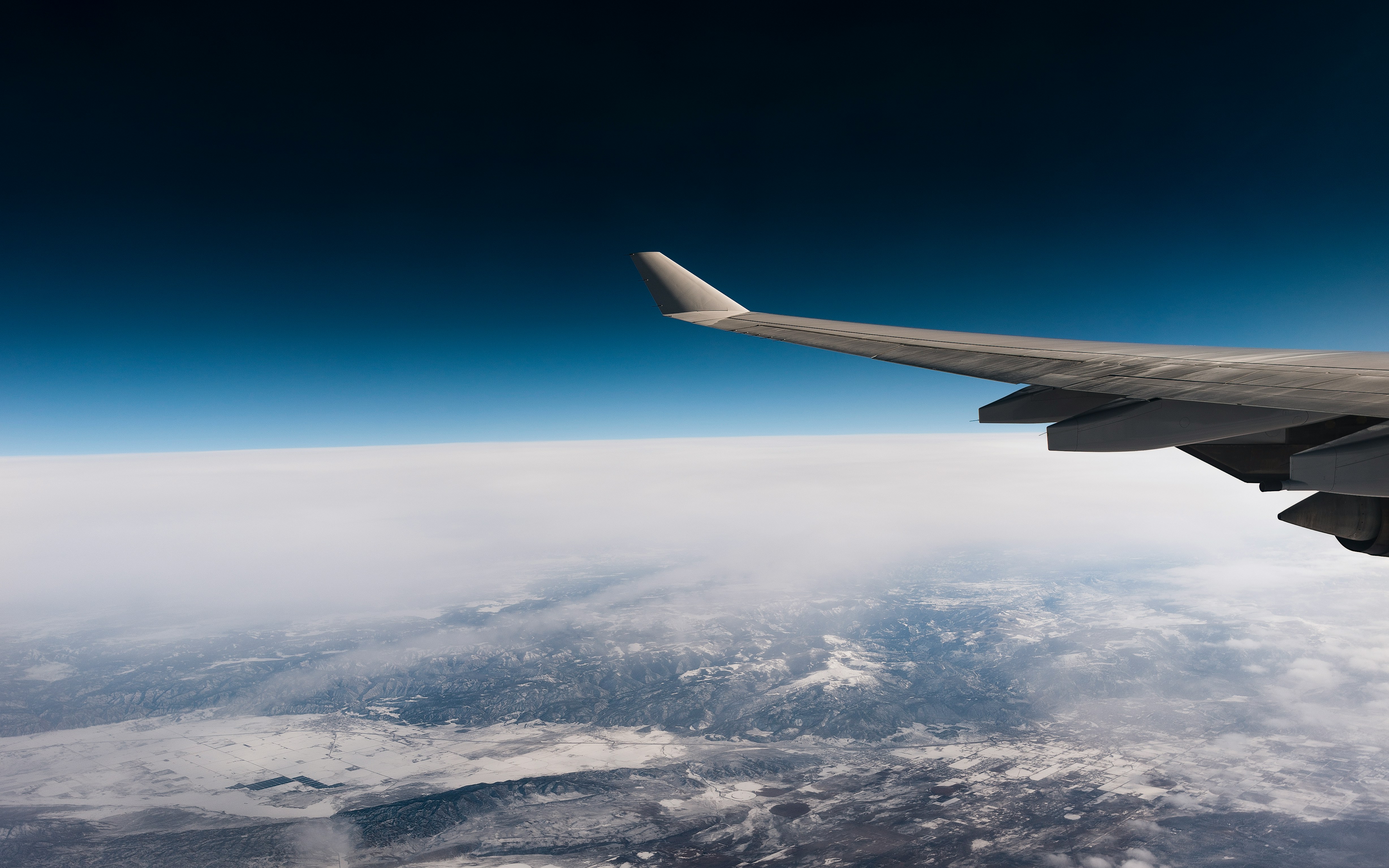 Plane wing looking out into space
