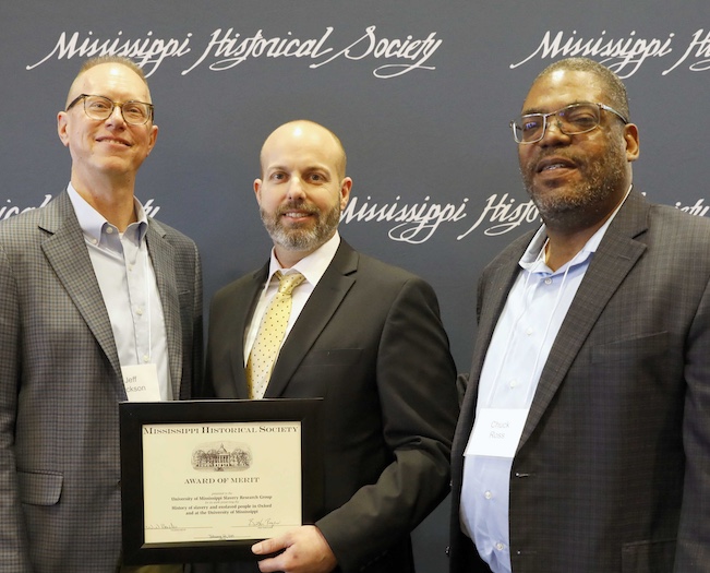 two professors accept award